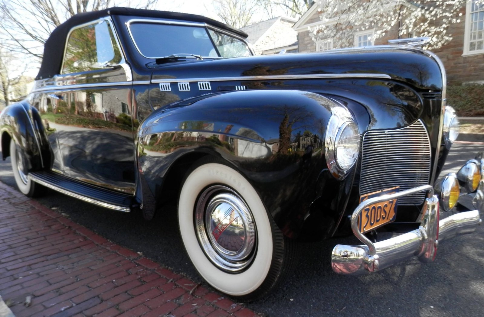Black 1940 DeSoto convertible with whitewall tires and chrome bumpers